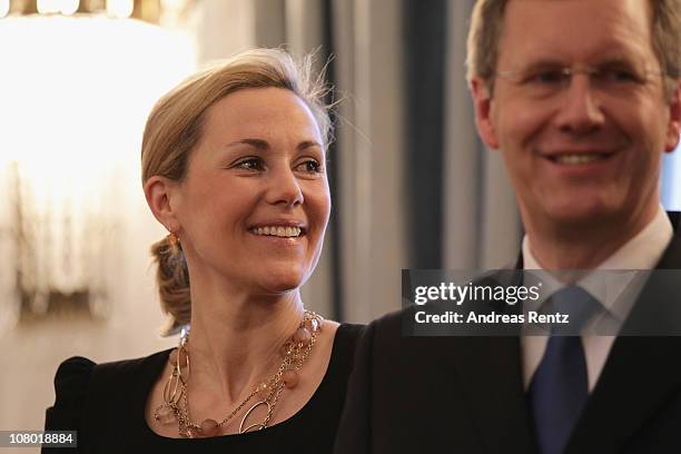 German First Lady Bettina Wulff and German President Christian Wulff gesture during the New Year's reception at Bellevue Palace on January 13, 2011...