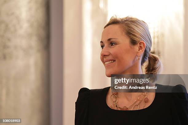 German First Lady Bettina Wulff gestures during the New Year's reception at Bellevue Palace on January 13, 2011 in Berlin, Germany. German President...