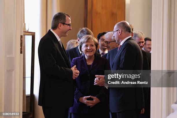 German Chancellor Angela Merkel smiles during the New Year's reception at Bellevue Palace on January 13, 2011 in Berlin, Germany. German President...