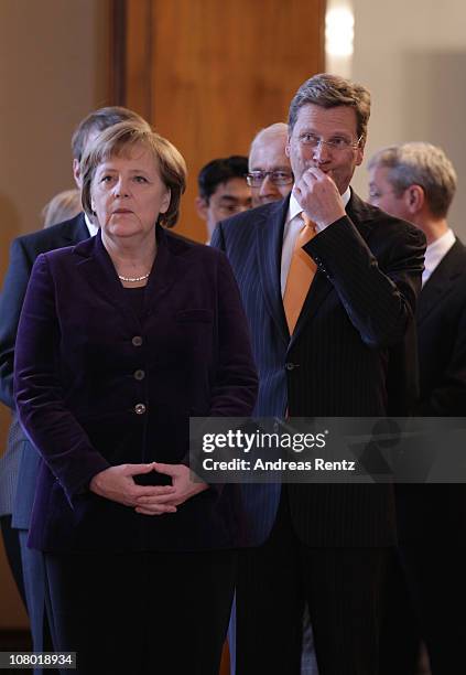 German Chancellor Angela Merkel and German Vice Chancellor and Foreign Minister Guido Westerwelle attend the New Year's reception at Bellevue Palace...