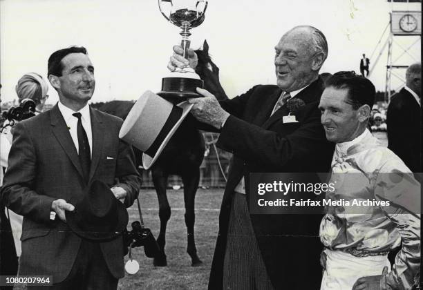 Melbourne Cup Presentation -- Trainer Mr. Robins, owner Mr. Reid and jockey Jim Johnson.Eight years ago, in his spare time at Broken Hill, miner Mr....