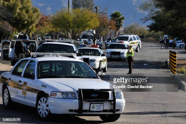 Pima County Sheriff deploy at St. Elizabeth Ann Seton church prior to the funeral services for nine-year-old Christina Taylor Green on January 13,...