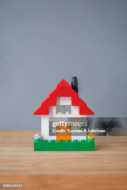 house made of toy bricks - toys house stock pictures, royalty-free photos & images