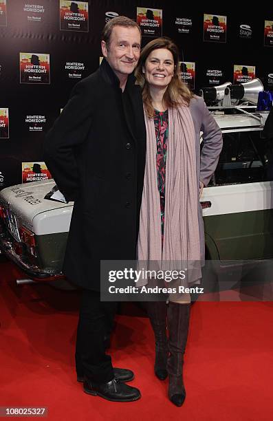 Peter Lohmeyer and Sarah Wiener arrive for the 'Hinterm Horizont' musical premiere at Theater am Potsdamer Platz on January 13, 2011 in Berlin,...
