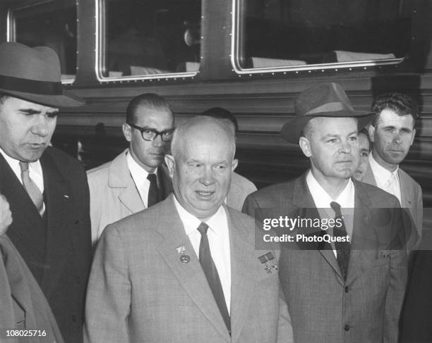 Surrounded by aides, Soviet leader Nikita Khrushchev stands on a train platform while on a state visit to the United States, September 15, 1959.