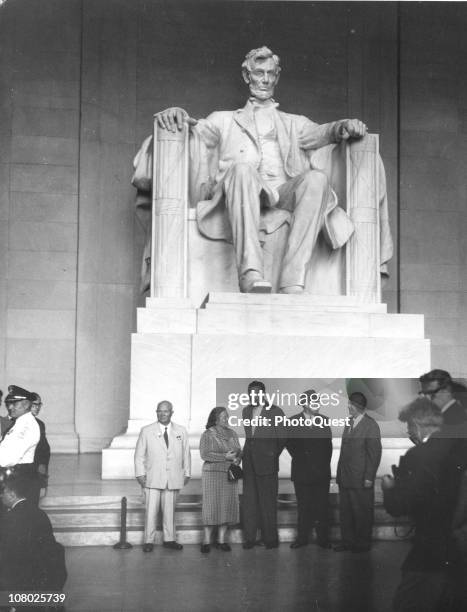 Soviet leader Nikita Khrushchev and his wife, Nina Khrushcheva , along with several unidentified others stand nest to the Lincoln Memorial while on a...