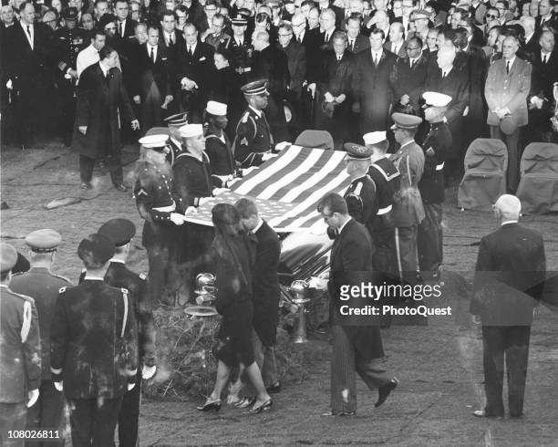 At Arlington National Cemetary, Jacqueline Kennedy , accompanied by her brothers-in-law Robert F. Kennedy and Ted Kennedy , approach the gravesite of...