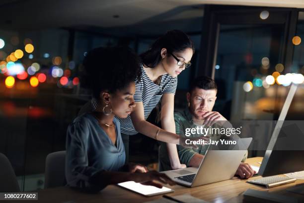 these night owls always work with dedication - group of three people stock pictures, royalty-free photos & images