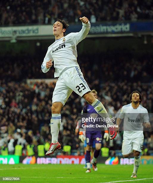 Mesut Ozil of Real Madrid celebrates after scoring Real's third goal during the Copa del Rey quarter final first leg match between Real Madrid and...
