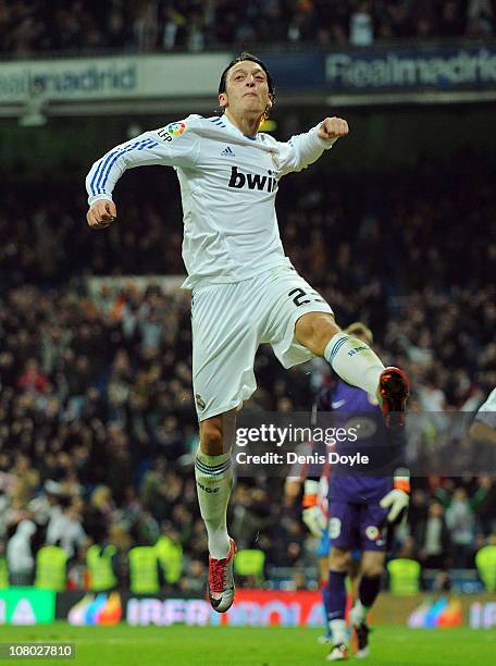 Mesut Ozil of Real Madrid celebrates after scoring Real's third goal during the Copa del Rey quarter final first leg match between Real Madrid and...