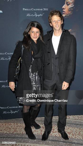 French TV presenter Marion Jolles and Romain Grosjean attend the Pirelli 2011 Calendar lauch at Le Mini Palais on January 13, 2011 in Paris, France.