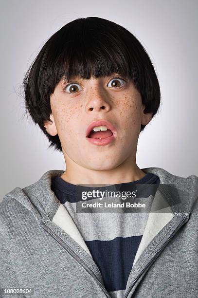 portrait of a scared boy 9-11 years - 10 to 13 years stock pictures, royalty-free photos & images