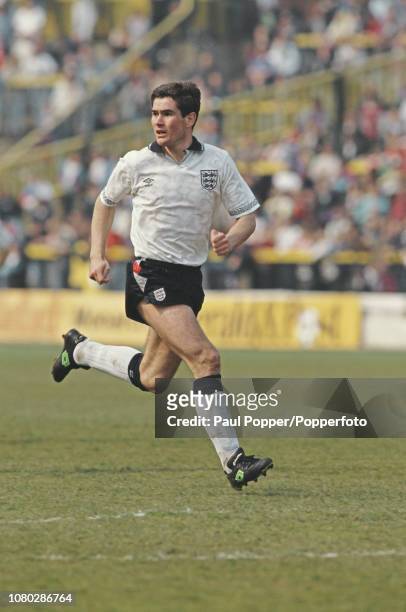 English professional footballer Nigel Clough, midfielder with Nottingham Forest, pictured in action during play in the international match between...