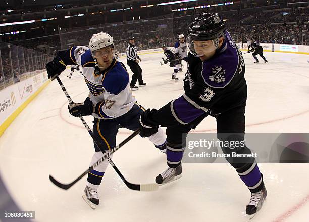 Vladimir Sobotka of the St. Louis Blues and Jack Johnson of the Los Angeles Kings battle for the puck at the Staples Center on January 13, 2011 in...