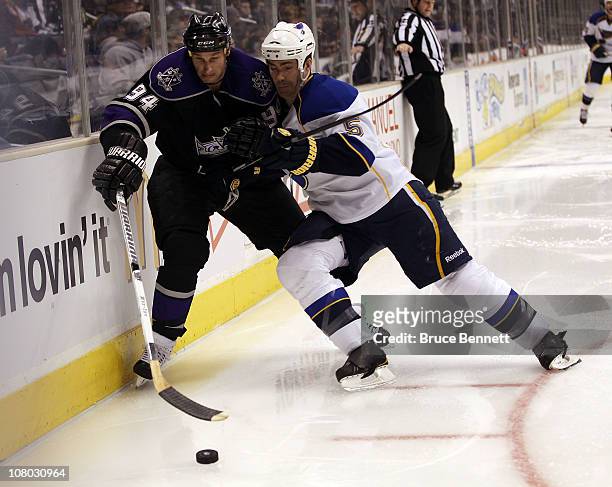 Barret Jackman of the St. Louis Blues rides Ryan Smyth of the Los Angeles Kings into the boards at the Staples Center on January 13, 2011 in Los...