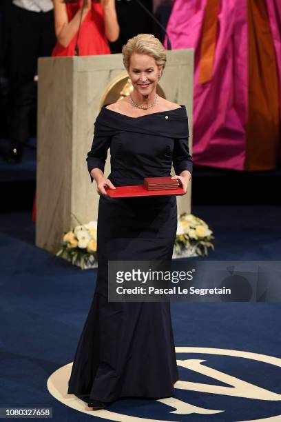 Frances H. Arnold, laureate of the Nobel Prize in Chemistry acknowledges applause after she received her Nobel Prize from King Carl XVI Gustaf of...