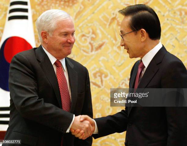 Secretary of Defense Robert Gates shakes hands with the President of the Republic of Korea Lee Myung-bak during their meeting at the Blue House on...