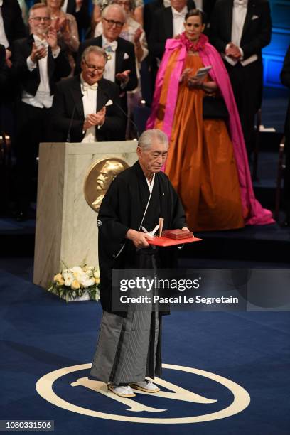 Tasuku Honjo, laureate of the Nobel Prize in Physiology or Medicine acknowledges applause after he received his Nobel Prize from King Carl XVI Gustaf...