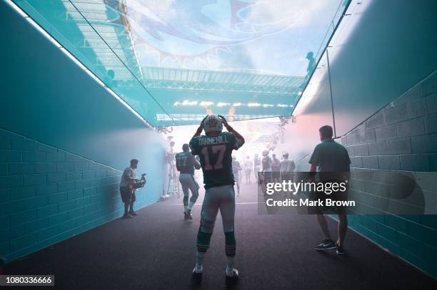 Ryan Tannehill of the Miami Dolphins waits to be introduced before the game against the New England Patriots at Hard Rock Stadium on December 9, 2018...