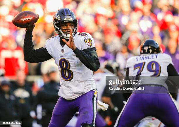 Quarterback Lamar Jackson of the Baltimore Ravens throws a fourth quarter pass against the Kansas City Chiefs at Arrowhead Stadium on December 9,...