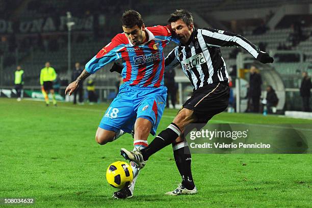 Zdenek Grygera of Juventus FC clashes with Blazej Augustyn of Catania Calcio during the Tim Cup match between Juventus FC and Catania Calcio at...