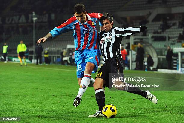 Zdenek Grygera of Juventus FC competes with Blazej Augustyn of Catania Calcio during the Tim Cup match between Juventus FC and Catania Calcio at...