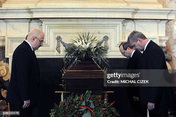 Guards of honour bow next to the coffin containing the remains of former Czech senator and former Czech Foreign Minister Jiri Dienstbier on January...