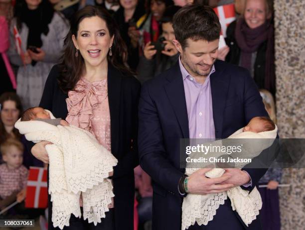 Princess Mary of Denmark and Crown Prince Frederik of Denmark hold their new-born baby twins as they leave the Rigshospitalet on January 14, 2011 in...