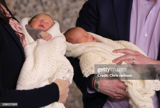 Princess Mary of Denmark and Crown Prince Frederik of Denmark hold their new-born baby twins as they leave the Rigshospitalet on January 14, 2011 in...