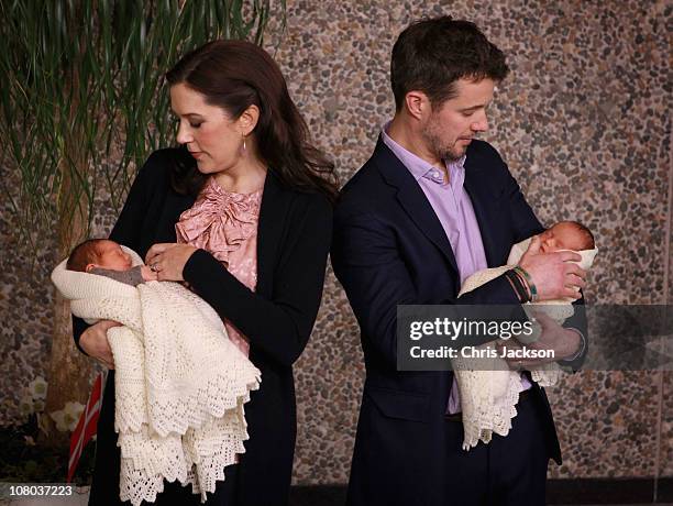 Princess Mary of Denmark and Crown Prince Frederik of Denmark hold their new-born baby twins as they leave the Rigshospitalet on January 14, 2011 in...