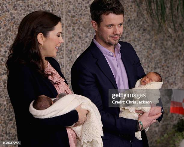 Princess Mary of Denmark and Crown Prince Frederik of Denmark hold their new-born baby twins as they leave the Rigshospitalet on January 14, 2011 in...