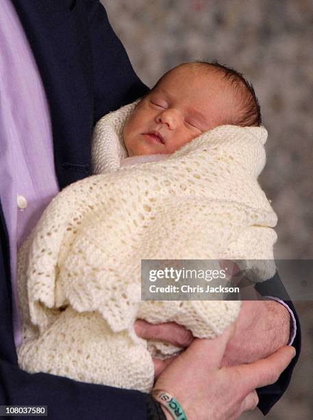 Crown Prince Frederik of Denmark holds a new-born baby twin as they leave the Rigshospitalet on January 14, 2011 in Copenhagen, Denmark. Princess...