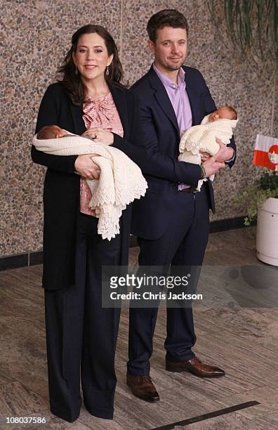 Princess Mary of Denmark and Crown Prince Frederik of Denmark hold their new-born baby twins as they leave the Rigshospitalet on January 14, 2011 in...
