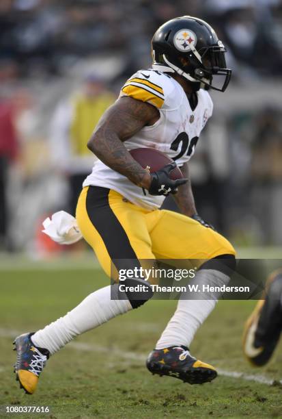 Stevan Ridley of the Pittsburgh Steelers carries the ball against the Oakland Raiders during the second half of an NFL football game at...