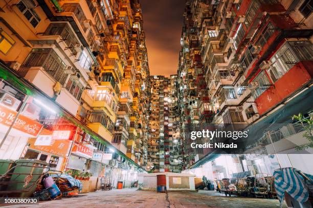 crowded housing, apartment buildings in hong kong, china - court notice stock pictures, royalty-free photos & images