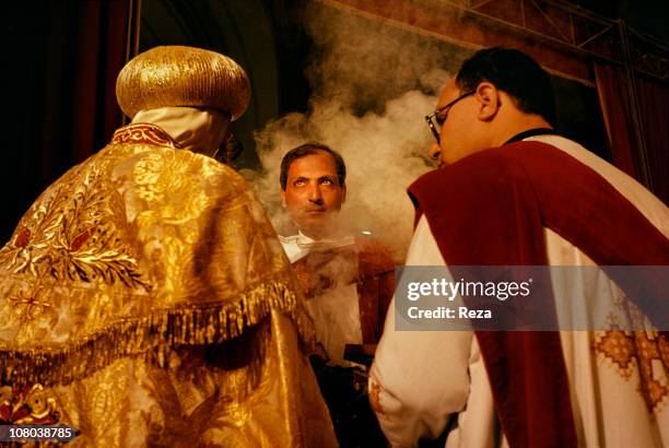 The scent and smoke of incense, which is an integral part of all Coptic ceremonies, fill the Cathedral of St Mark in Cairo, during the Coptic...