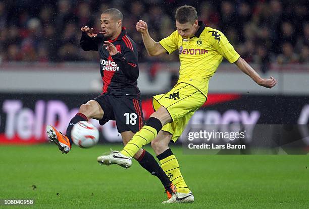 Sidney Sam of Leverkusen challenges Sven Bender of Dortmund during the Bundesliga match between Bayer Leverkusen and Borussia Dortmund at BayArena on...