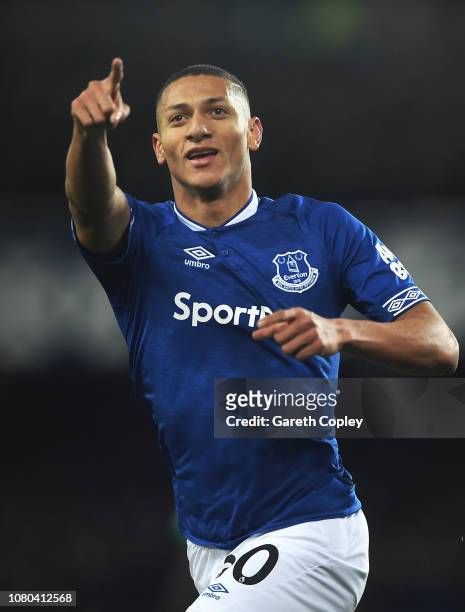 Richarlison of Everton celebrates scoring the first goal during the Premier League match between Everton FC and Watford FC at Goodison Park on...