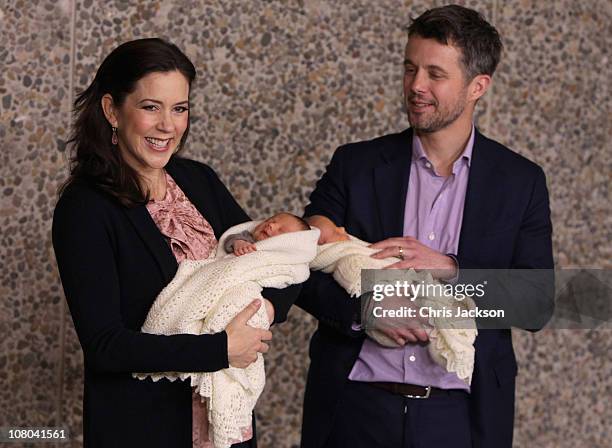 Princess Mary of Denmark and Crown Prince Frederik of Denmark hold their new-born baby twins as they leave the Rigshospitalet on January 14, 2011 in...