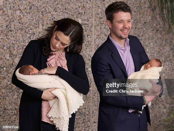 Princess Mary of Denmark and Crown Prince Frederik of Denmark hold their new-born baby twins as they leave the Rigshospitalet on January 14, 2011 in...