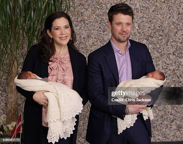 Princess Mary of Denmark and Crown Prince Frederik of Denmark hold their new-born baby twins as they leave the Rigshospitalet on January 14, 2011 in...