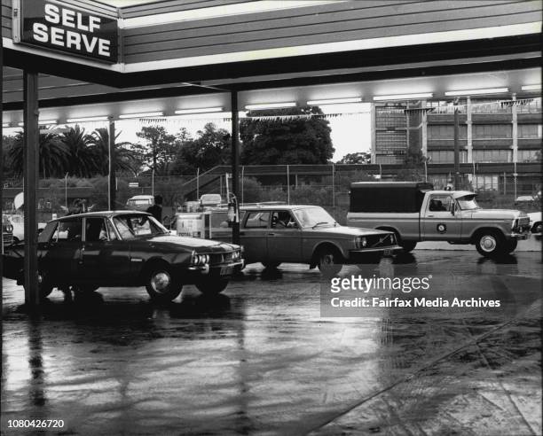 During the oil crisis of 1973-74, doctors fill their cars up with petrol under police supervision at the Total Self Service station in Allison Road,...