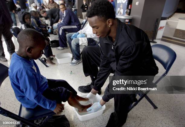 Hasheem Thabeet of the Memphis Grizzlies washes feet during a Samaritan's feet event on January 14, 2011 at FedExForum in Memphis, Tennessee. NOTE TO...