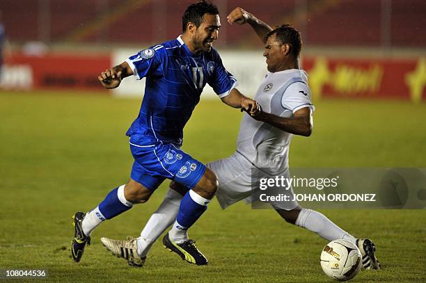 El Salvador's Jose Alvares vies for the ball with Nicaragua's Felix Zeledon during their UNCAF Nations Cup football match on January 14, 2011 in...