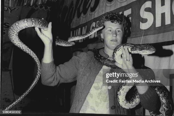 Royal Easter ShowMrs. S. Frazer pictured with a carpet snake and python.Mrs Shirley Frazer with two of her "pets" from the pit of death. The python,...