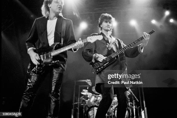 Alex Lifeson, left, and Geddy Lee of the band Rush performs at the Rosemont Horizon in Rosemont, Illinois, June 2. 1995.