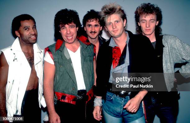 Portrait of the band Red Rider, left to right, Jeff Jones, Rob Baker, Peter Boynton, Tom Cochrane, and Ken Greer at the Park West in Chicago,...