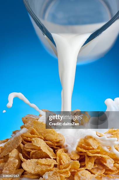 breakfast milk splash - cornflakes stock pictures, royalty-free photos & images