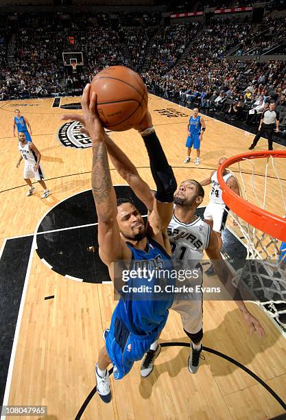 Tyson Chandler of the Dallas Mavericks dunks against Tim Duncan of the San Antonio Spurs during the game on January 14, 2011 at the AT&T Center in...