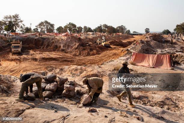 Miners move bags of cobalt inside the CDM Kasulo mine. "n"nCobalt is a vital mineral needed for the production of rechargeable batteries. Two thirds...